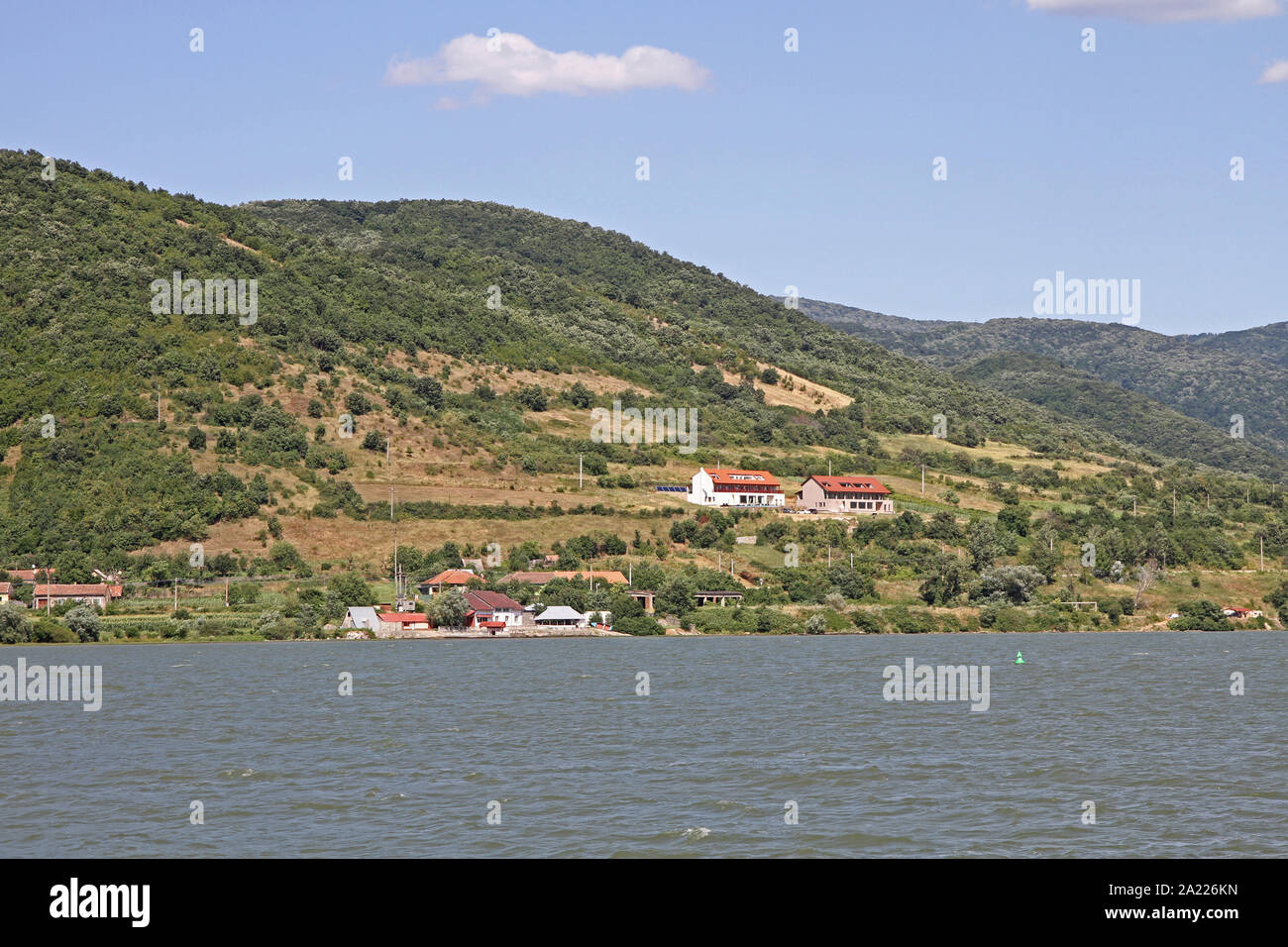 Small houses on the bank of the Danube River, on the border between Serbia and Romania. Stock Photo