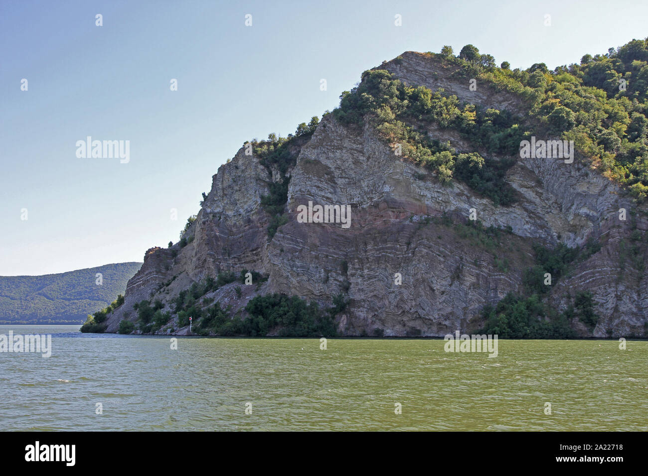 Rocky cliff around corner entering Donji Milanovac on the Danube River, border between Serbia and Romania, Donji Milanovac, Serbia. Stock Photo
