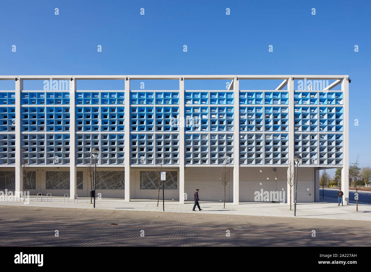 Front elevation with stone panels and perforated metal screens. Centre MK, Milton Keynes, United Kingdom. Architect: Leslie Jones Architecture, 2019. Stock Photo