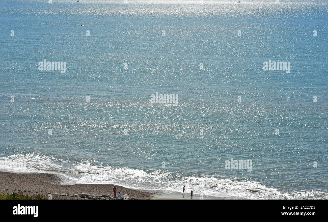 Shining sea - sunlight on the sea - breakers on the shore - summertime Stock Photo