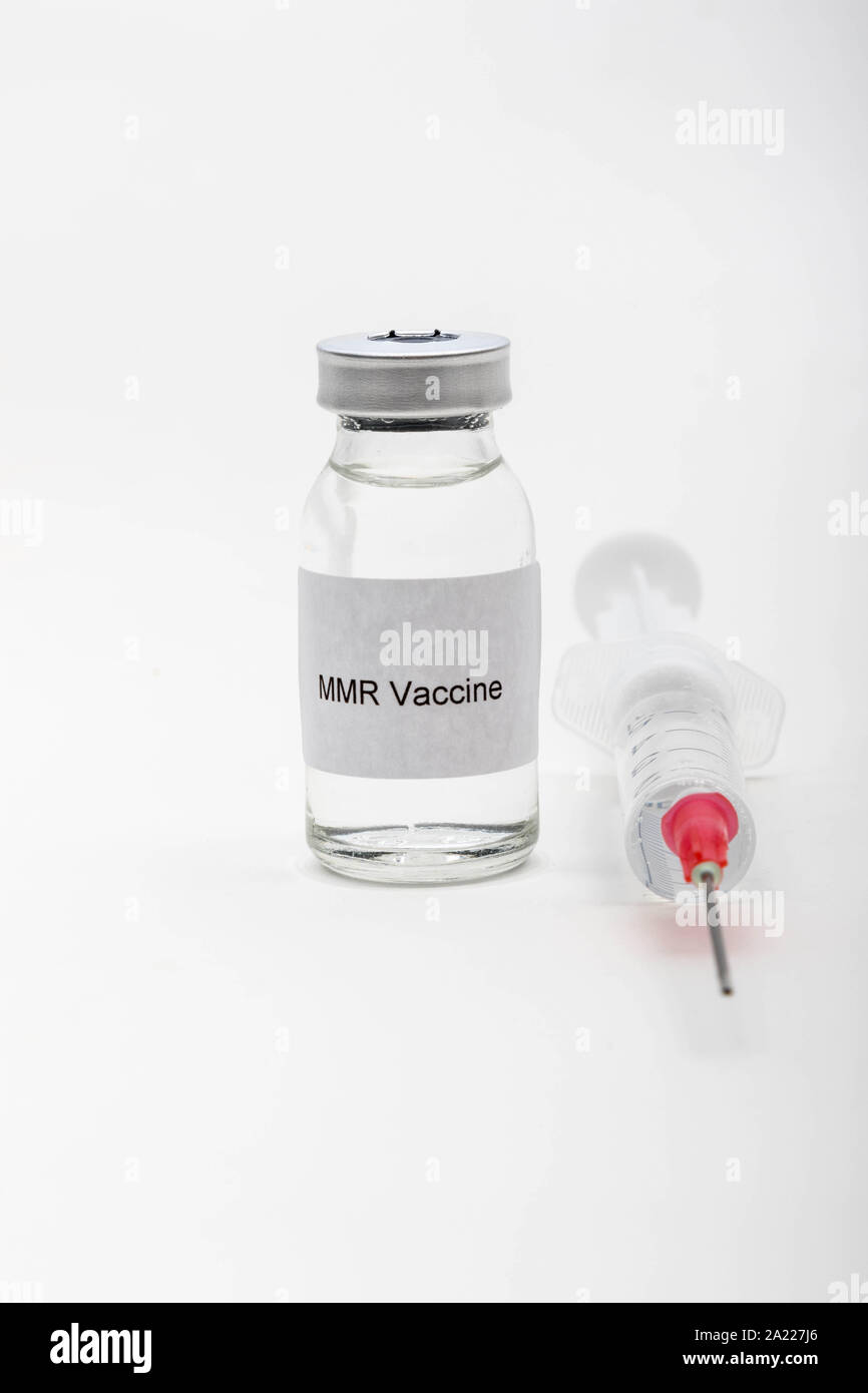 Medical concept showing medical a medical vial reading MMR Vaccine with a syringe Stock Photo