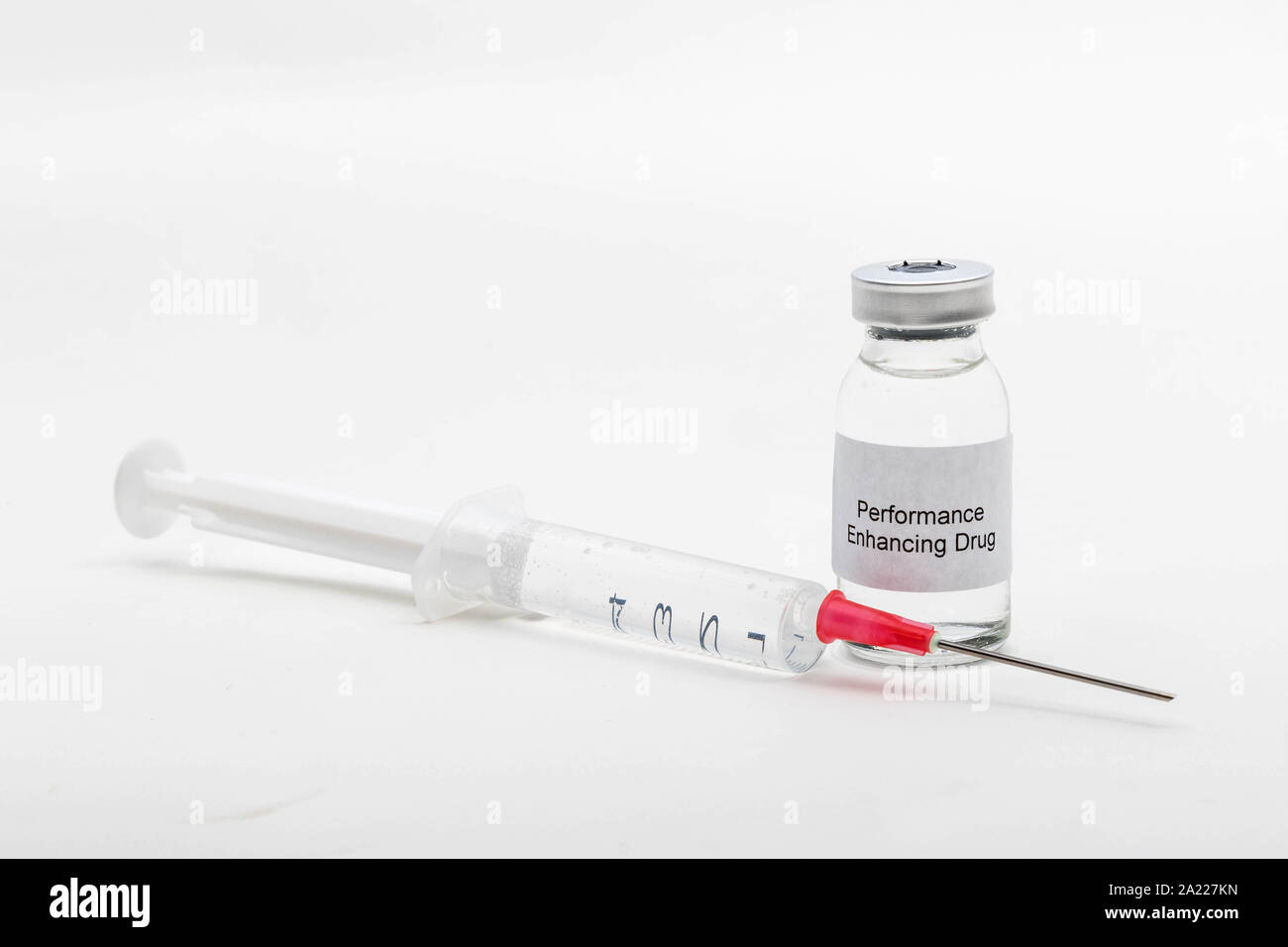 Medical concept showing medical a medical vial reading Performance Enhancing Drug with a syringe Stock Photo