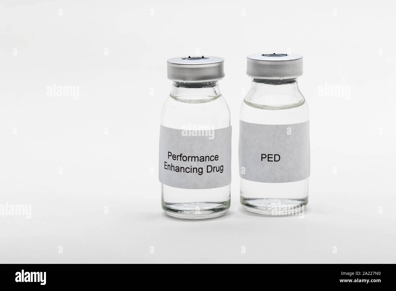 Medical concept showing medical 2 medical vials reading PED and Performance Enhancing Drug Stock Photo