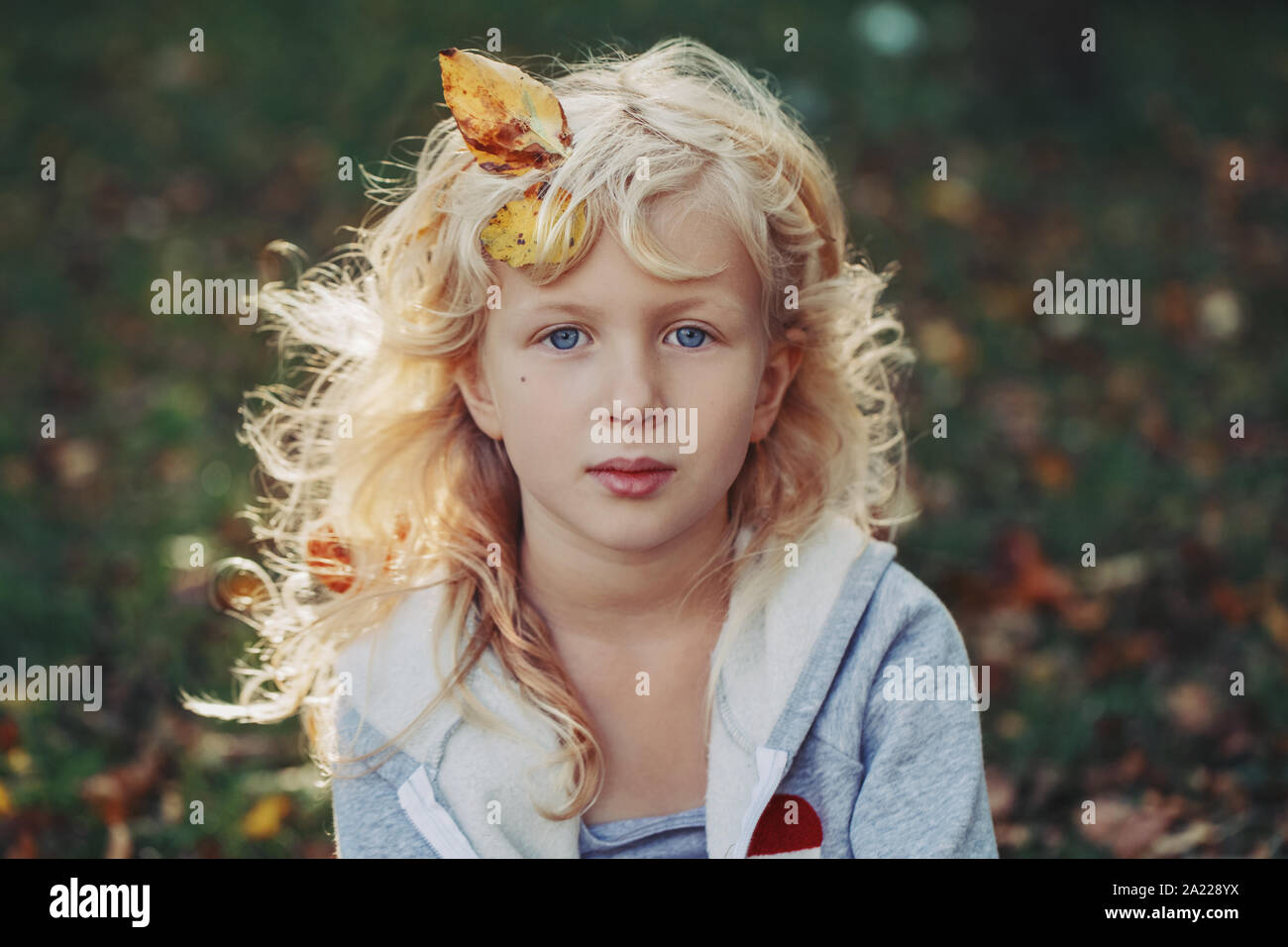 Beautiful Pretty Preschool Caucasian Blonde Girl With Autumn