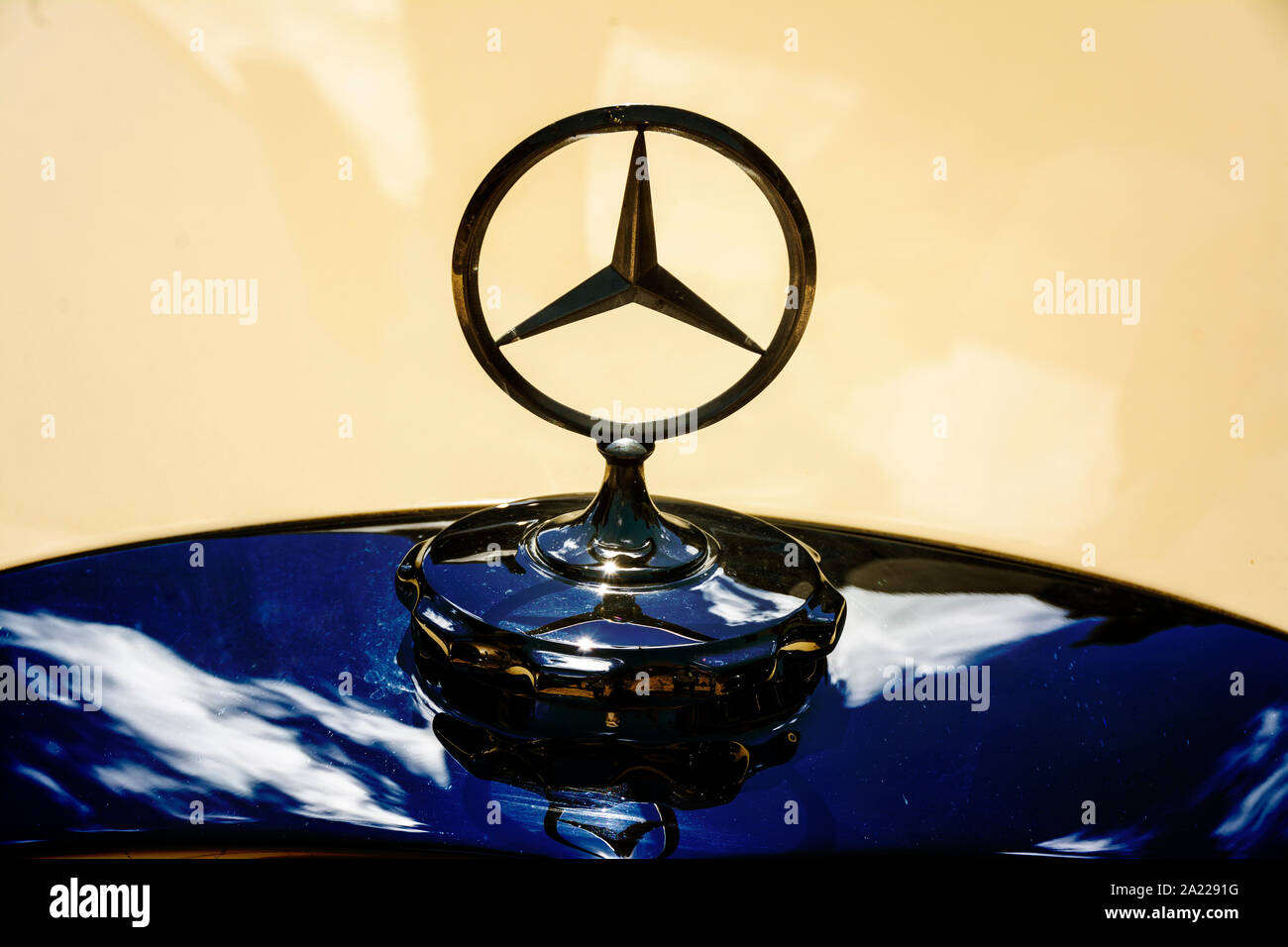The Mercedes-Benz logo on a classic car