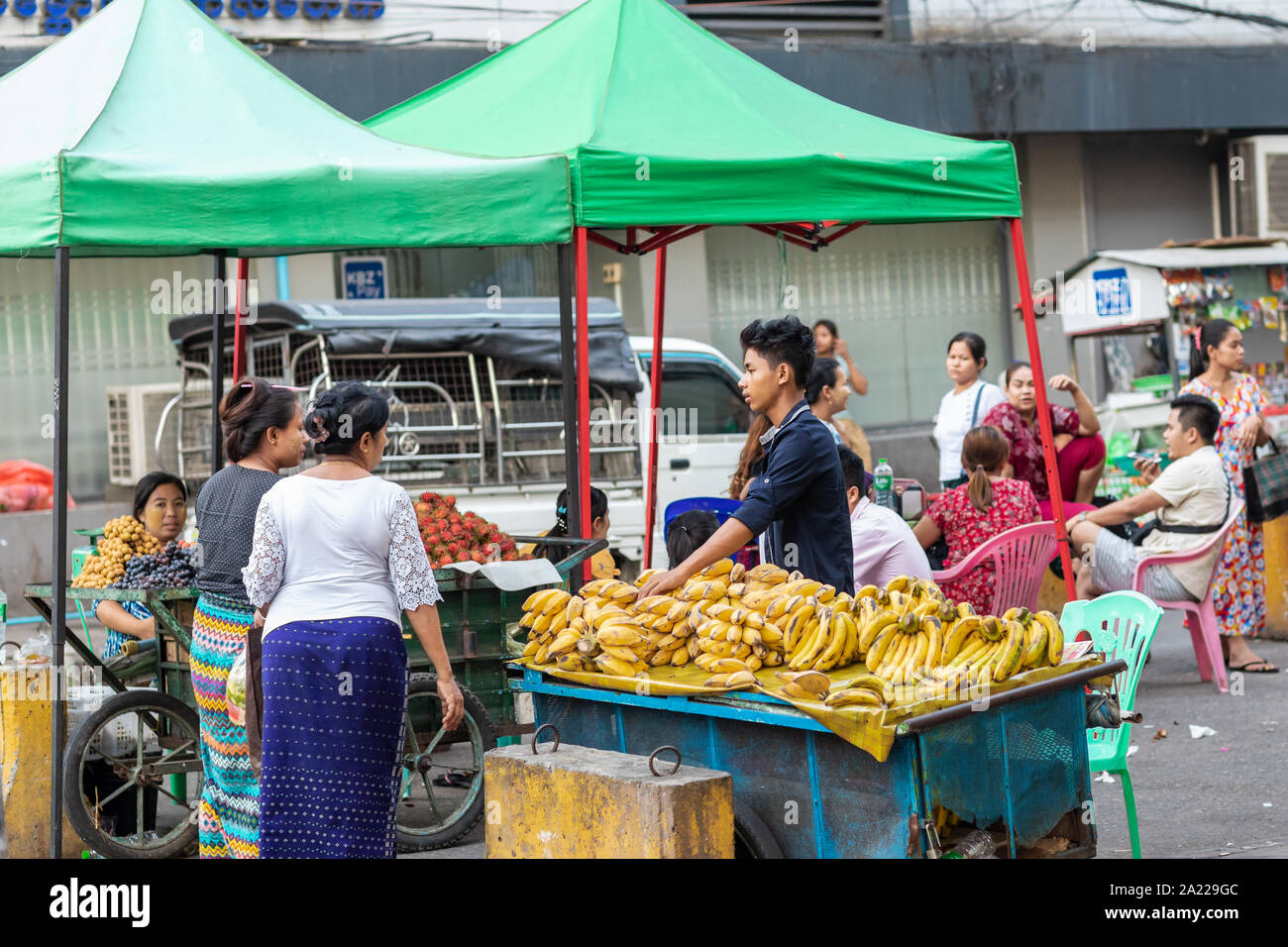 Selling banana fruits on street market in Yangon, Burma. Stock Photo