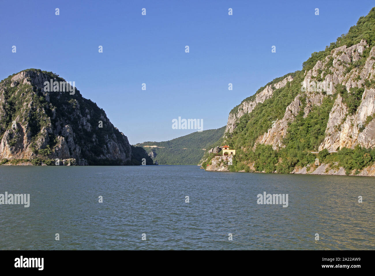 View of train station in Djerdap Gorge and entrance to The Iron Gate and The Great Cauldron on the Danube River, border between Romania and Serbia. Stock Photo