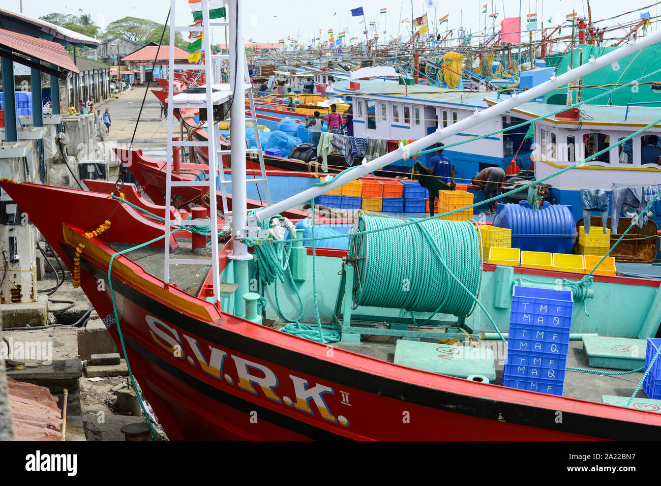 INDIA, Karnataka, Mangaluru, former name Mangalore, trawler in fishing port during monsoon, plastic fishing trawl nets and ropes which are a major source of plastic pollution of the oceans and dangerous for sea animals Stock Photo