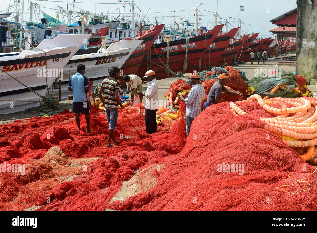 INDIA, Karnataka, Mangaluru, former name Mangalore, trawler in fishing port during monsoon, plastic fishing trawl nets and ropes which are a major source of plastic pollution of the oceans and dangerous for sea animals Stock Photo