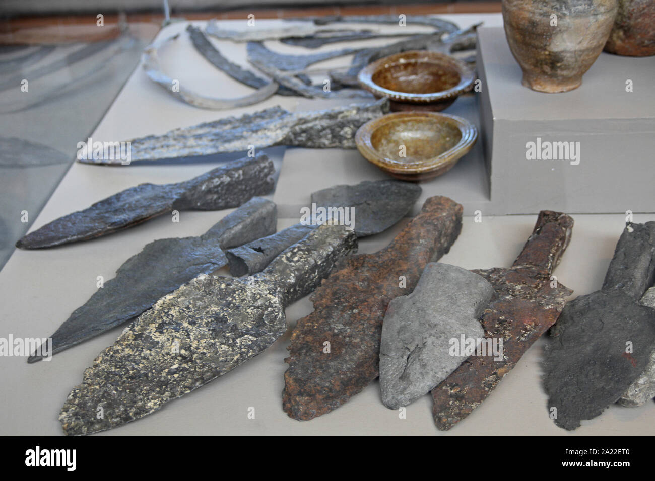 Collection of ancient spearheads and/or daggers and bowls, National Archeological Museum Djerdap, Kladovo, Serbia. Stock Photo