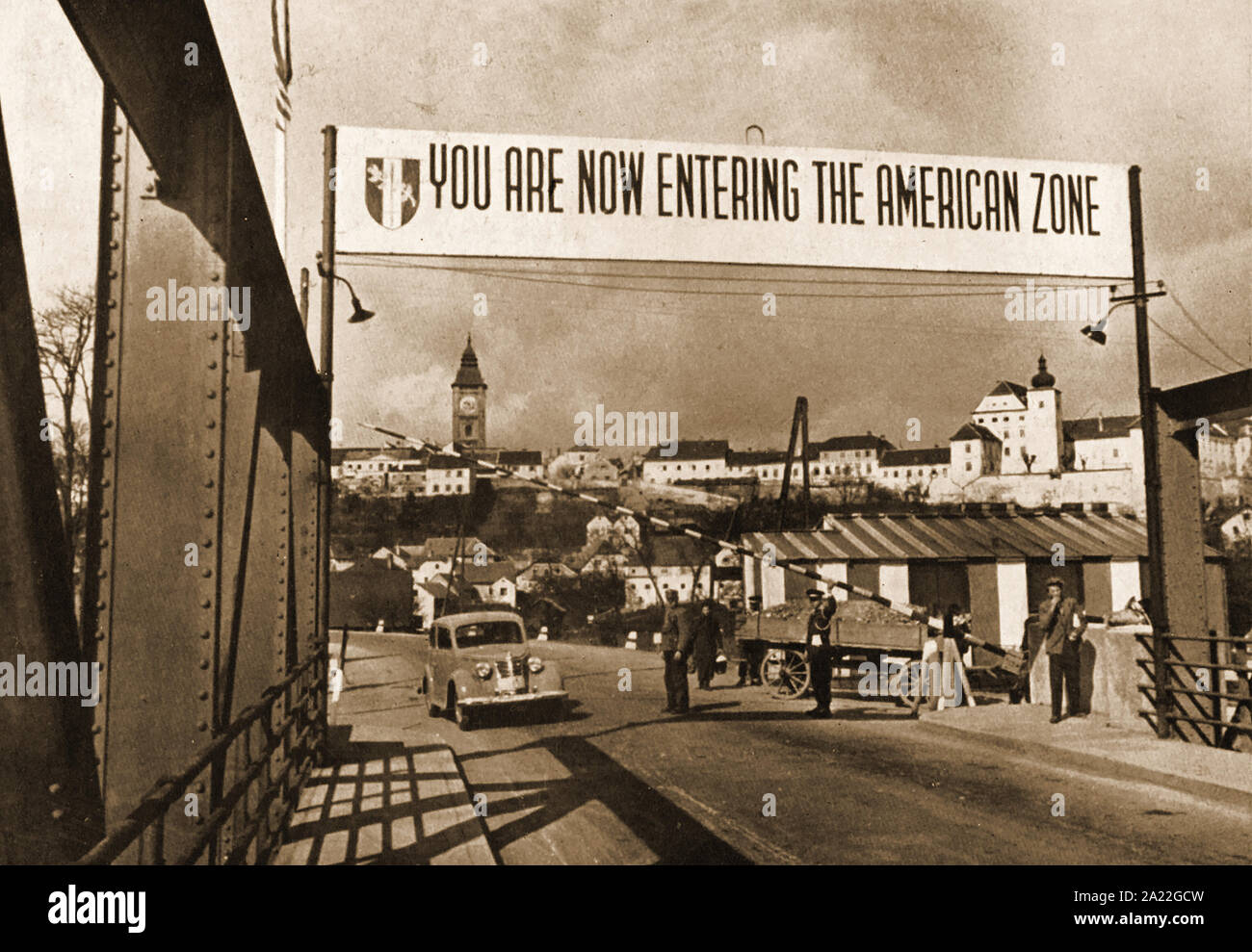 IRON CURTAIN  (1945-1991)  A term coined by Winston Churchill - A vintage photograph showing  a car crossing  the border between the American and Russian zones  at one of the checkpoints after WWII. Stock Photo