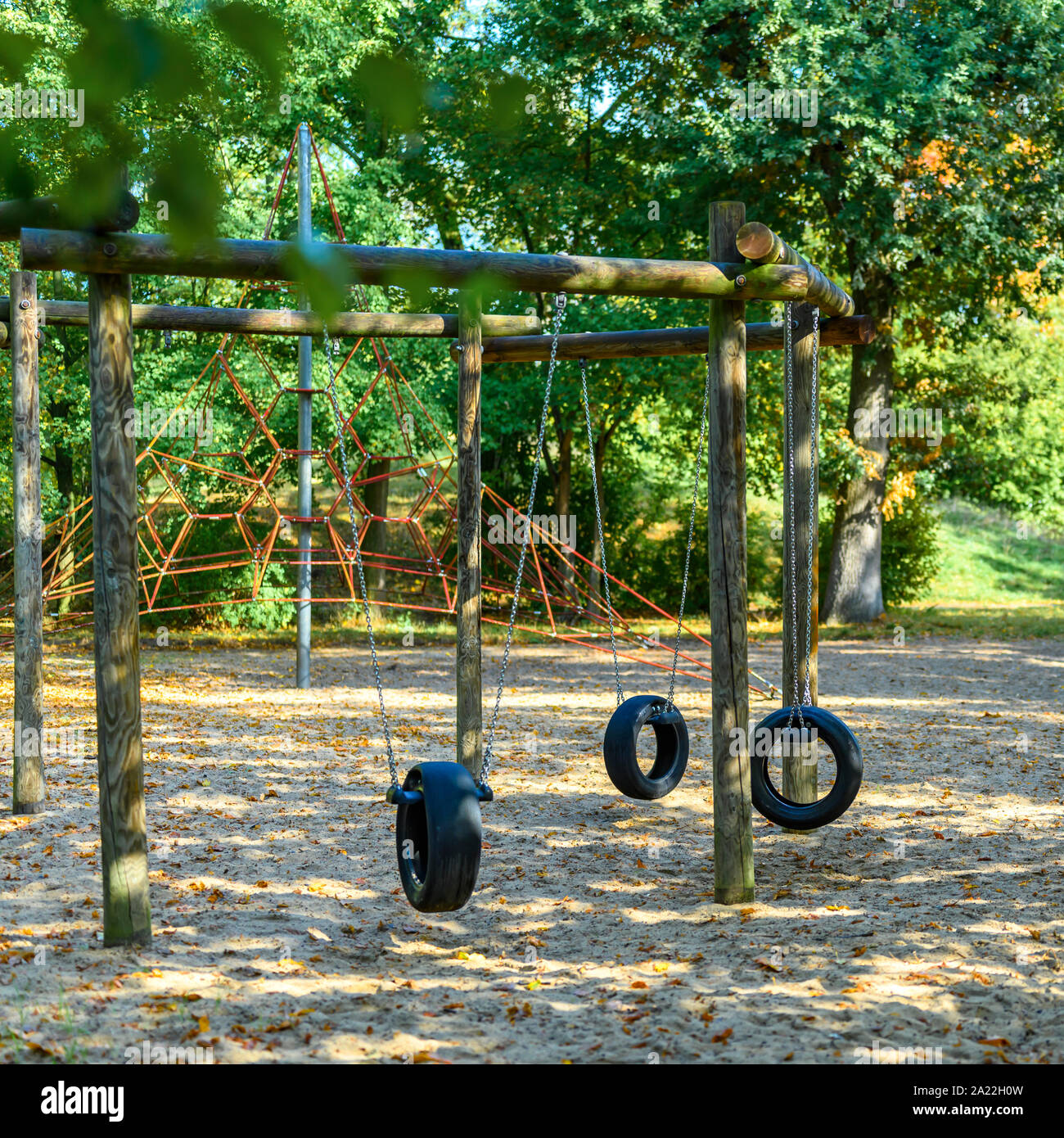 Children's playground in Germany with a tire swing and a climbing frame
