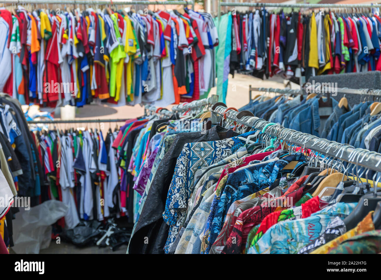 Colourful Shirts Garment Hanging at Flea Market Stock Photo