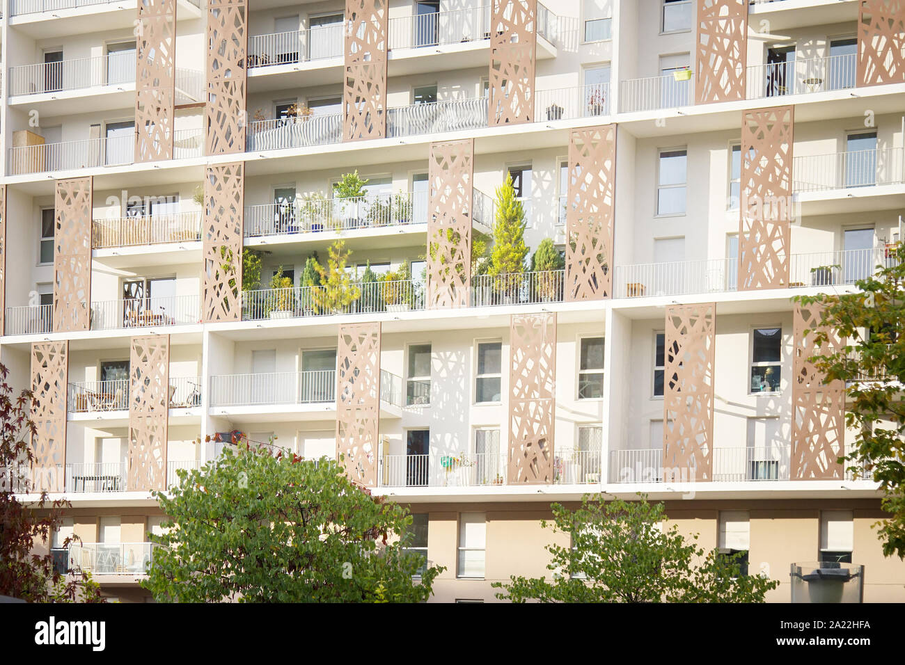 Flower beds, groves on balcony of multistorey residential building as