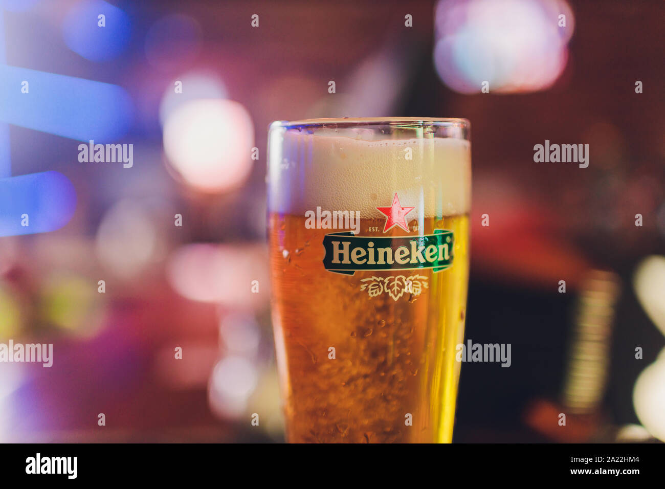 Ufa, Russia, 1 July, 2019 Heineken bartender poured beer into a glass Stock Photo