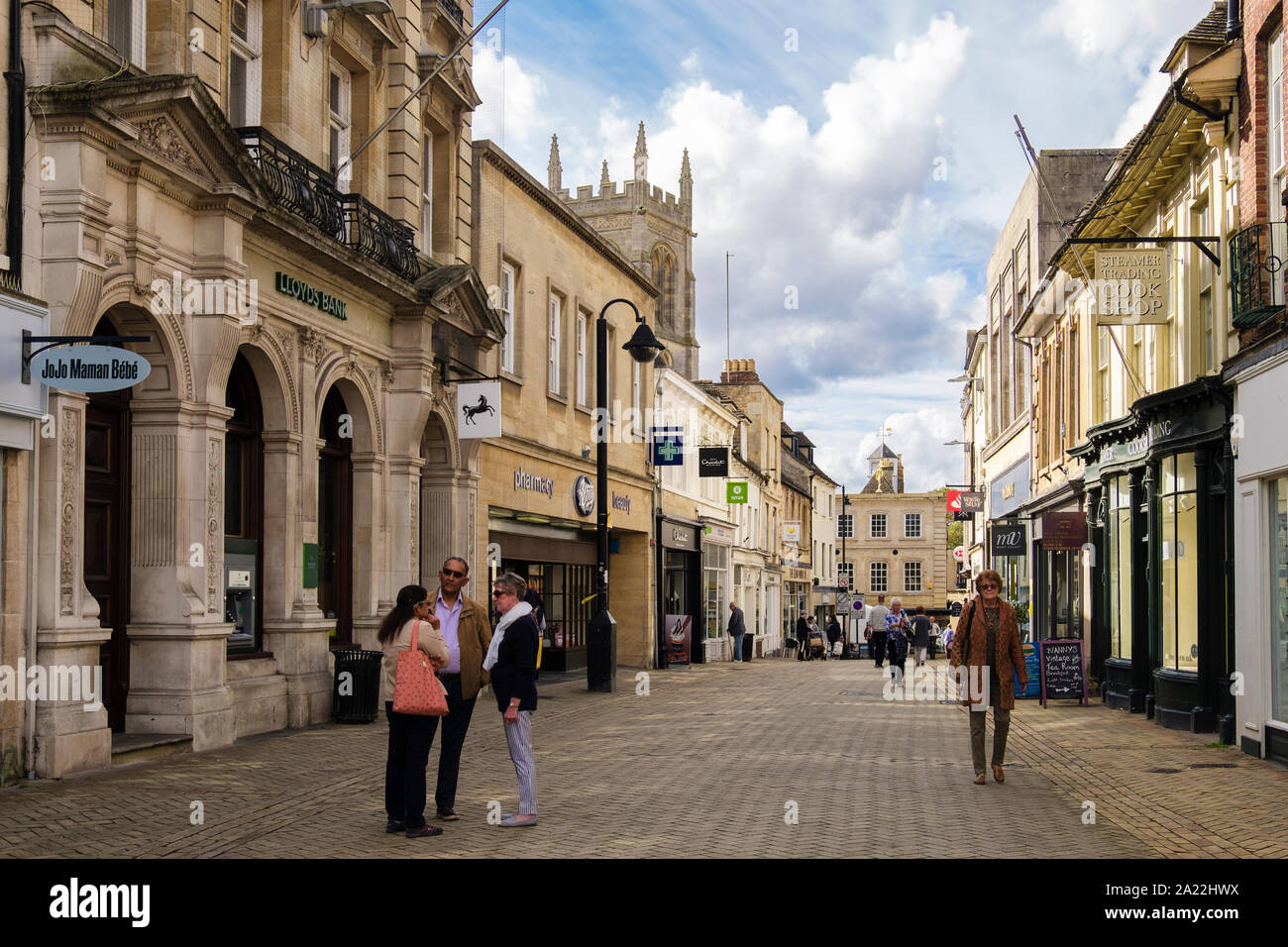 Quiet pedestrianised shopping street with shops in town centre. High