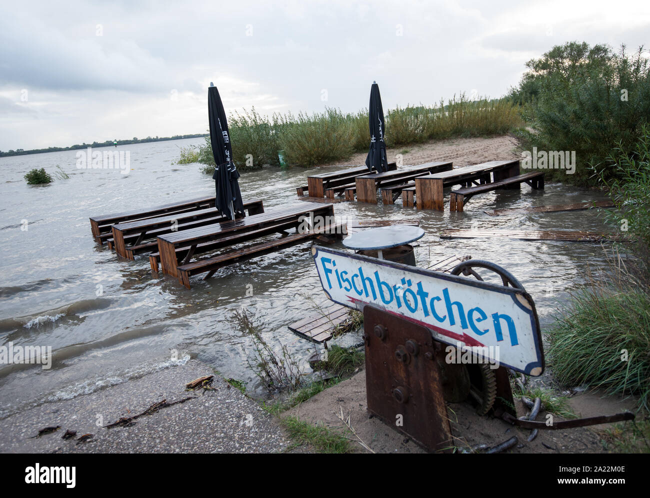 Hamburg, Germany. 30th Sep, 2019. Tables and benches of a restaurant are located in the district Blankenese during the flood on the flooded beach in the Elbe. Credit: Daniel Bockwoldt/dpa/Alamy Live News Stock Photo