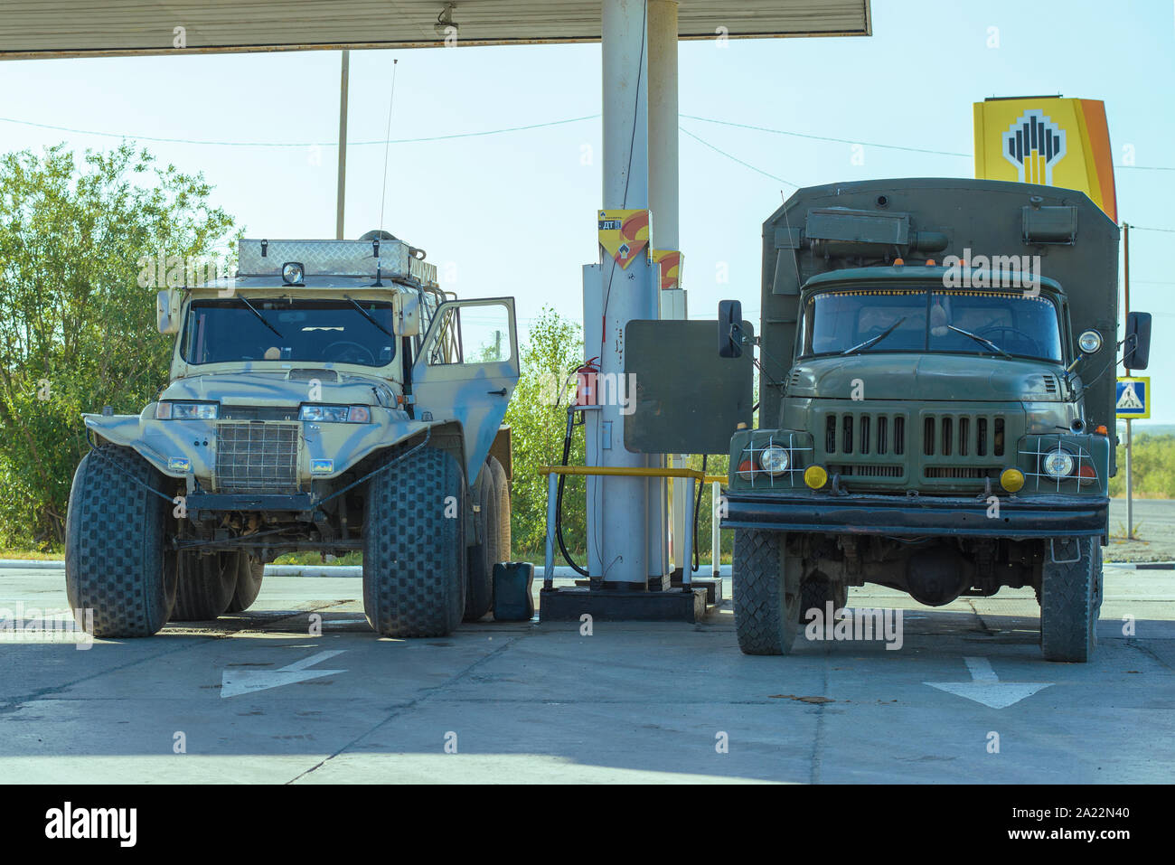 LABYTNANGI, RUSSIA - AUGUST 22, 2018: Two off-road carsTrekol and ZIL-131 on the car filling station Stock Photo