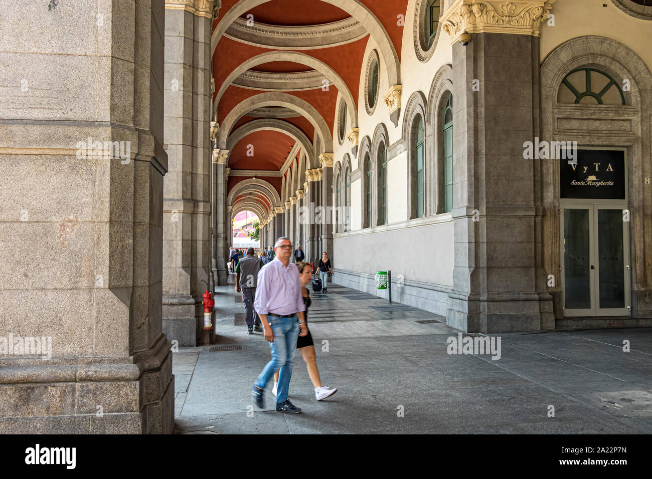 People walking under the elegant vaulted ceiling near the main  entrance to Porta Nuova  a major railway station in Turin ,Italy Stock Photo
