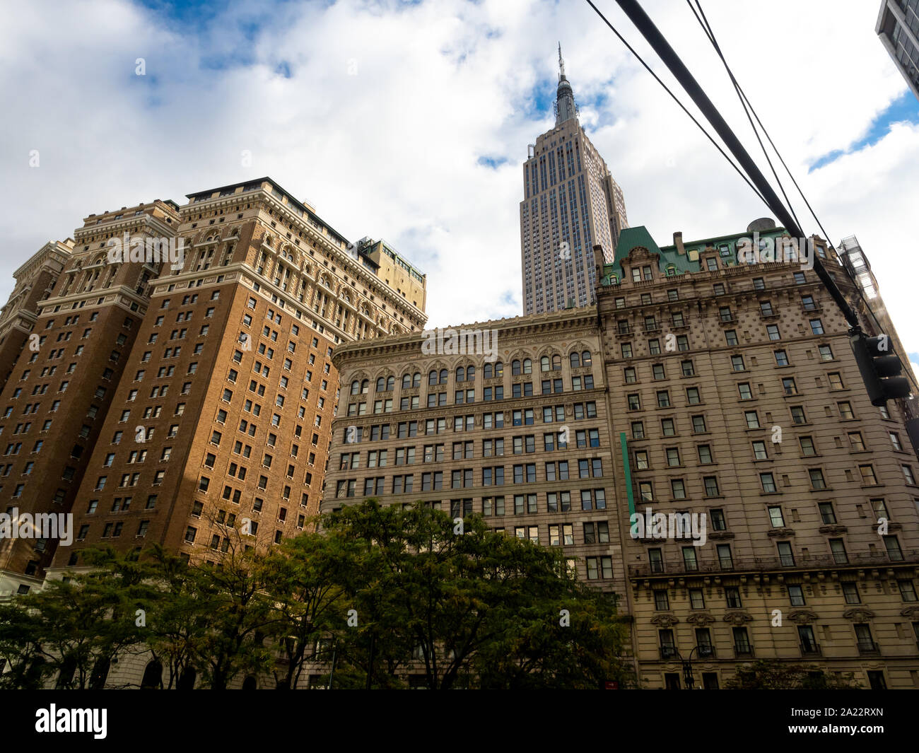 Most famous New York skyscraper poking out behind classic buildings in Midtown Manhattan Stock Photo