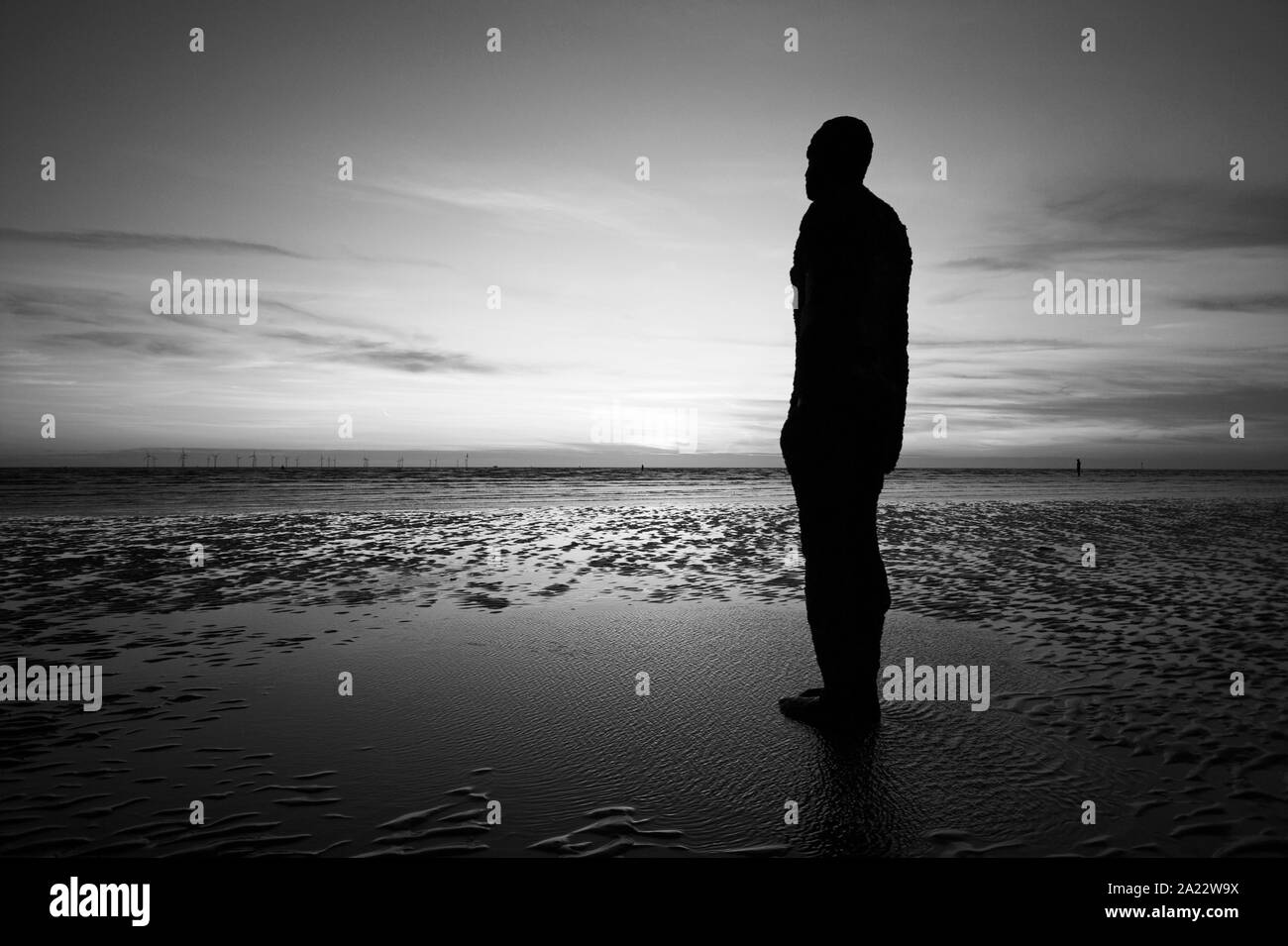 Statue by Anthony Gormley, Another Place, Liverpool, UK Stock Photo Alamy