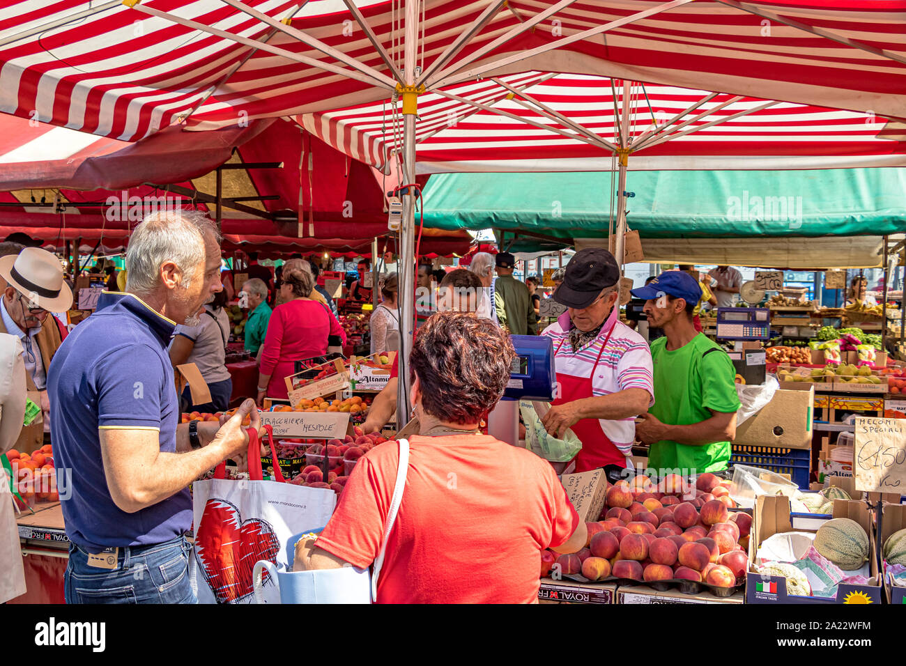 People shopping at Mercato di Porta Palazzo ,one of the largest open air markets in Europe selling a huge variety of fresh produce ,Turin ,Italy Stock Photo