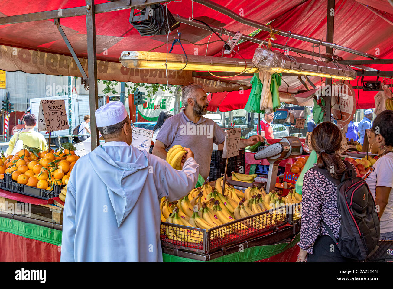People shopping at Mercato di Porta Palazzo ,one of the largest open air markets in Europe selling a huge variety of fresh produce ,Turin ,Italy Stock Photo