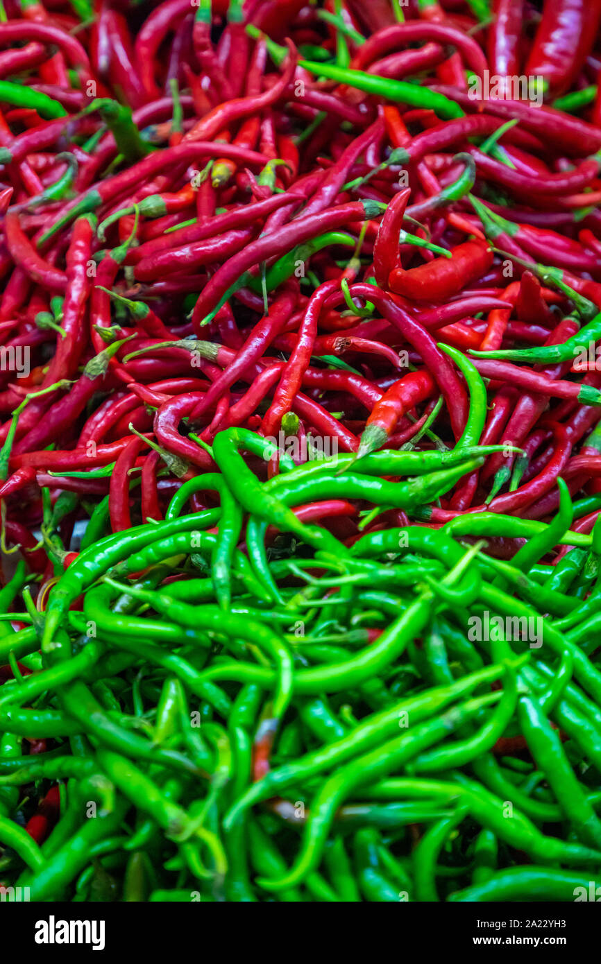 Green and red chili peppers background Stock Photo - Alamy