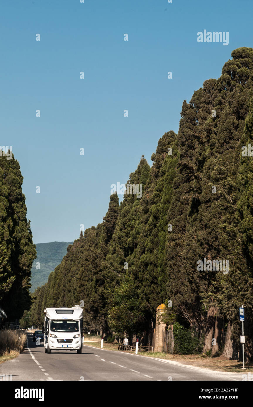 The famous tree-lined avenue with cypresses  two kilometers long that connects the Aurelia state road from the village of San Guido to the Bolgheri vi Stock Photo