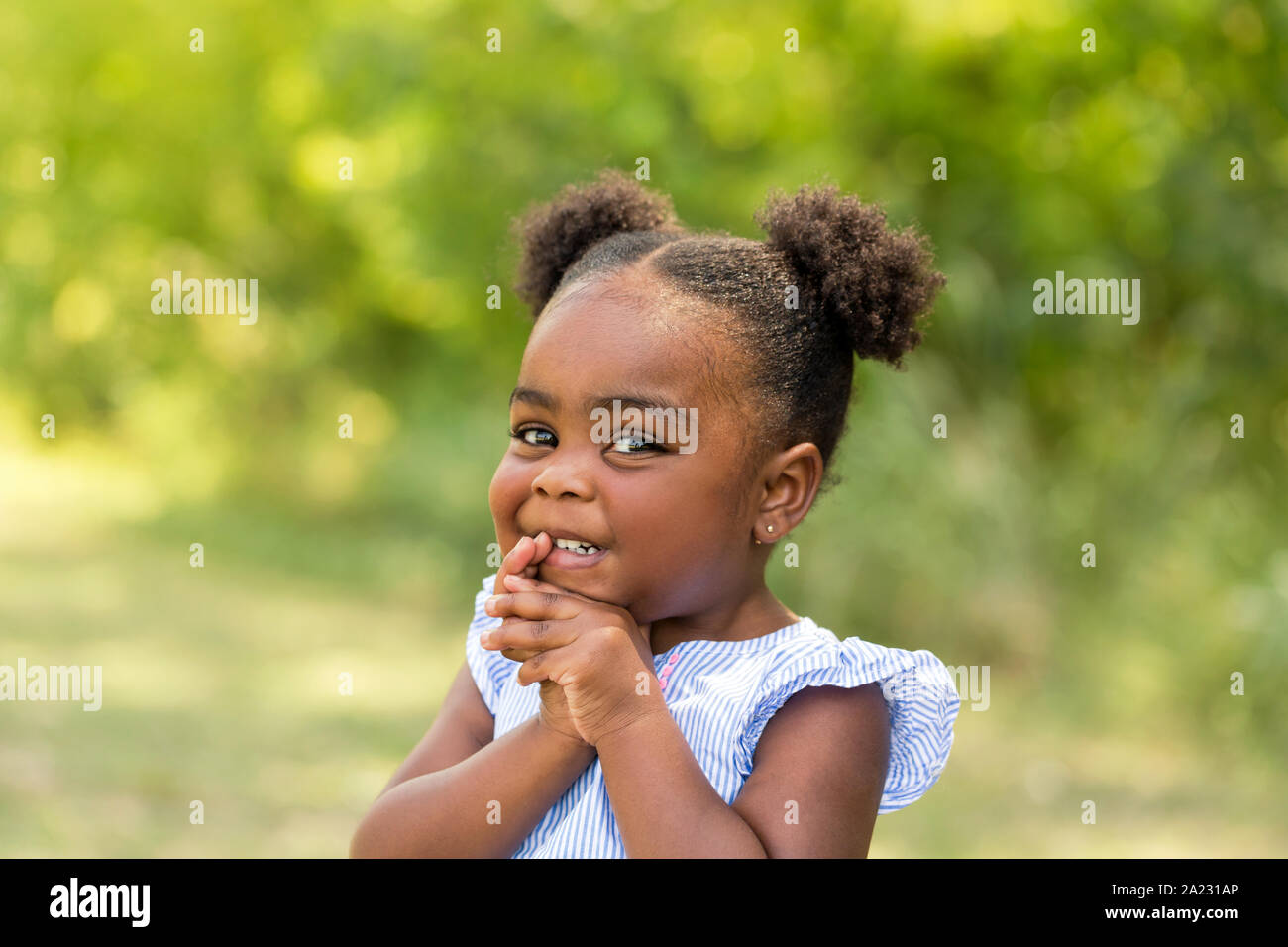 Cute little African American little girl smiling Stock Photo - Alamy