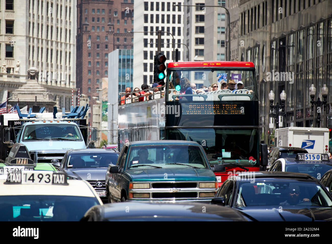 red open double deck bus tour stuck in traffic on michigan avenue downtown chicago illinois united states of america Stock Photo