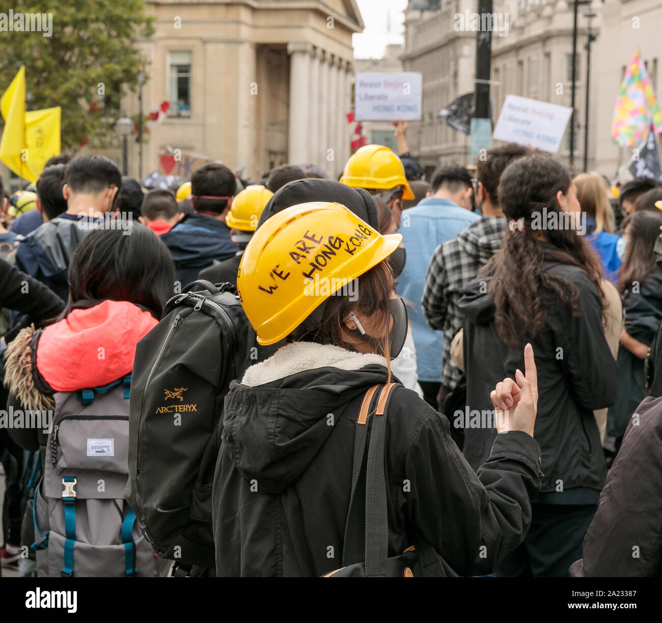 Download Protestor Wearing Face Mask And Yellow Hard Hat Bearing The Words We Are Hong Kong At Demonstration Against Chinese Rule In Hong Kong Trafalgar Square London 28th September 2019 Hundreds Pf People PSD Mockup Templates
