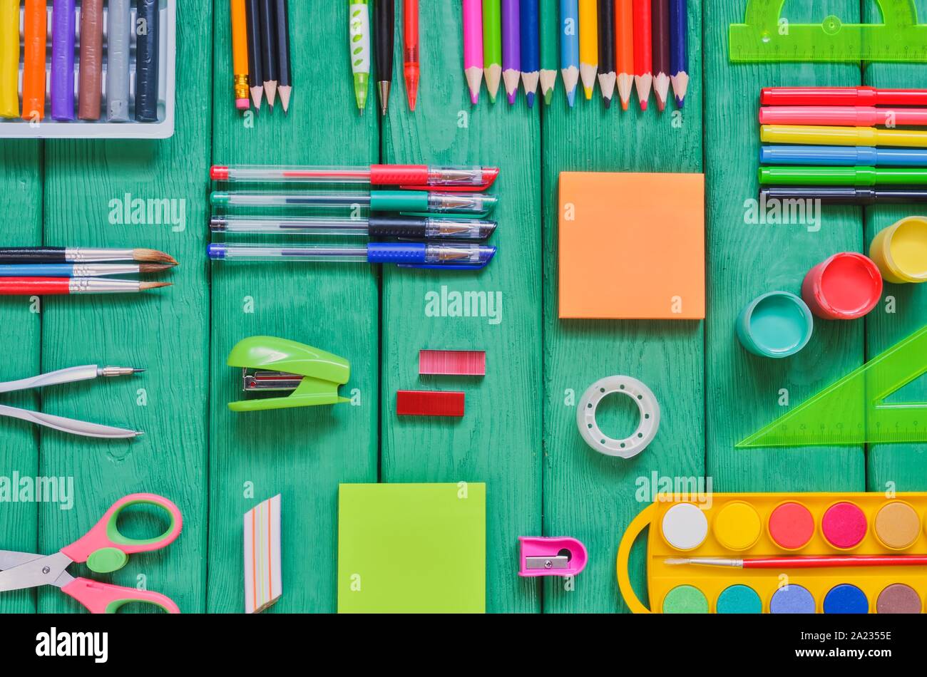 Creative School Concept Arranged School Accessories On A Green