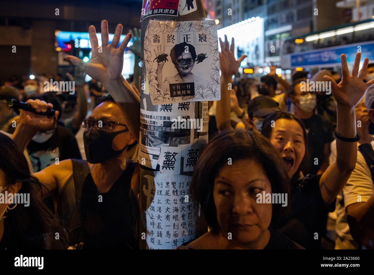 Demonstrators raise their hands open to symbolize the 5 demands protesters have in order to stop the protests a day before Chinese National Day.Pro-Democracy protester have been protesting across Hong Kong for the past few months calling for the government to meet their demands including setting up an independent inquiry into police misconduct and abuse of power over the past few months of protest in Hong Kong, Also calling for universal suffrage. Stock Photo