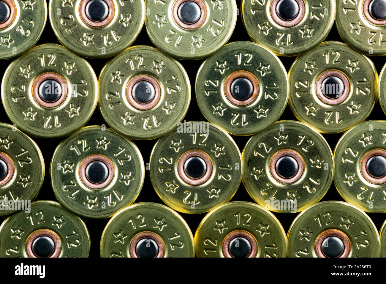 Shotgun cartridges piled against a black background Stock Photo - Alamy