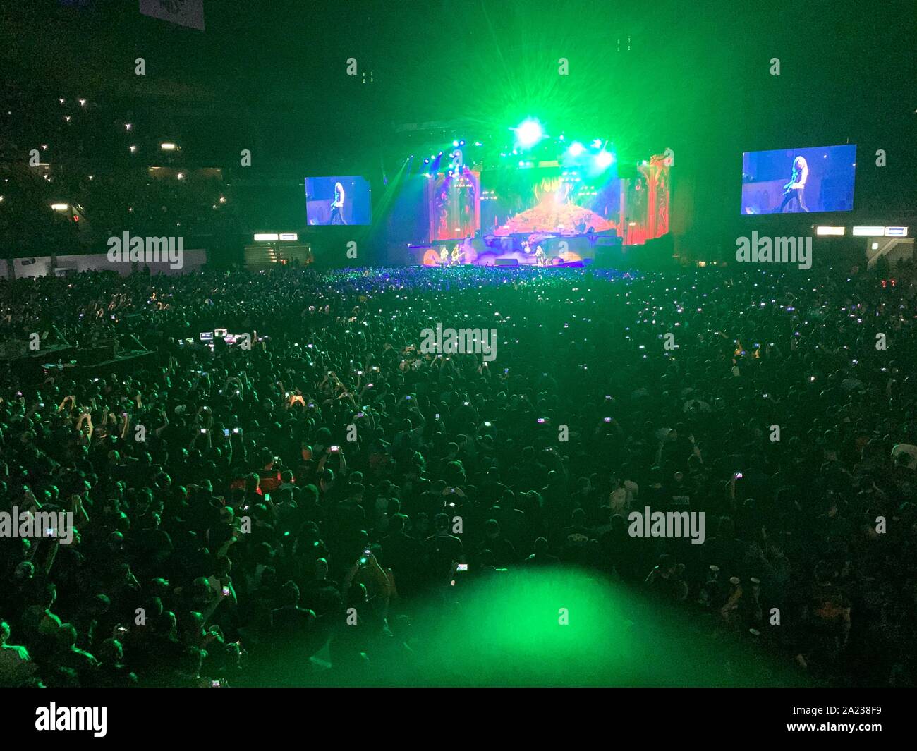 Panoramic view of thousands of fans attending the Iron Maiden concert in the Sports Palace of the city of Mexico. vista panoramica de miles de fanaticos asitentes al concierto de Iron Maiden en el palacio de los Deportes de la ciduad de Mexico. Stock Photo