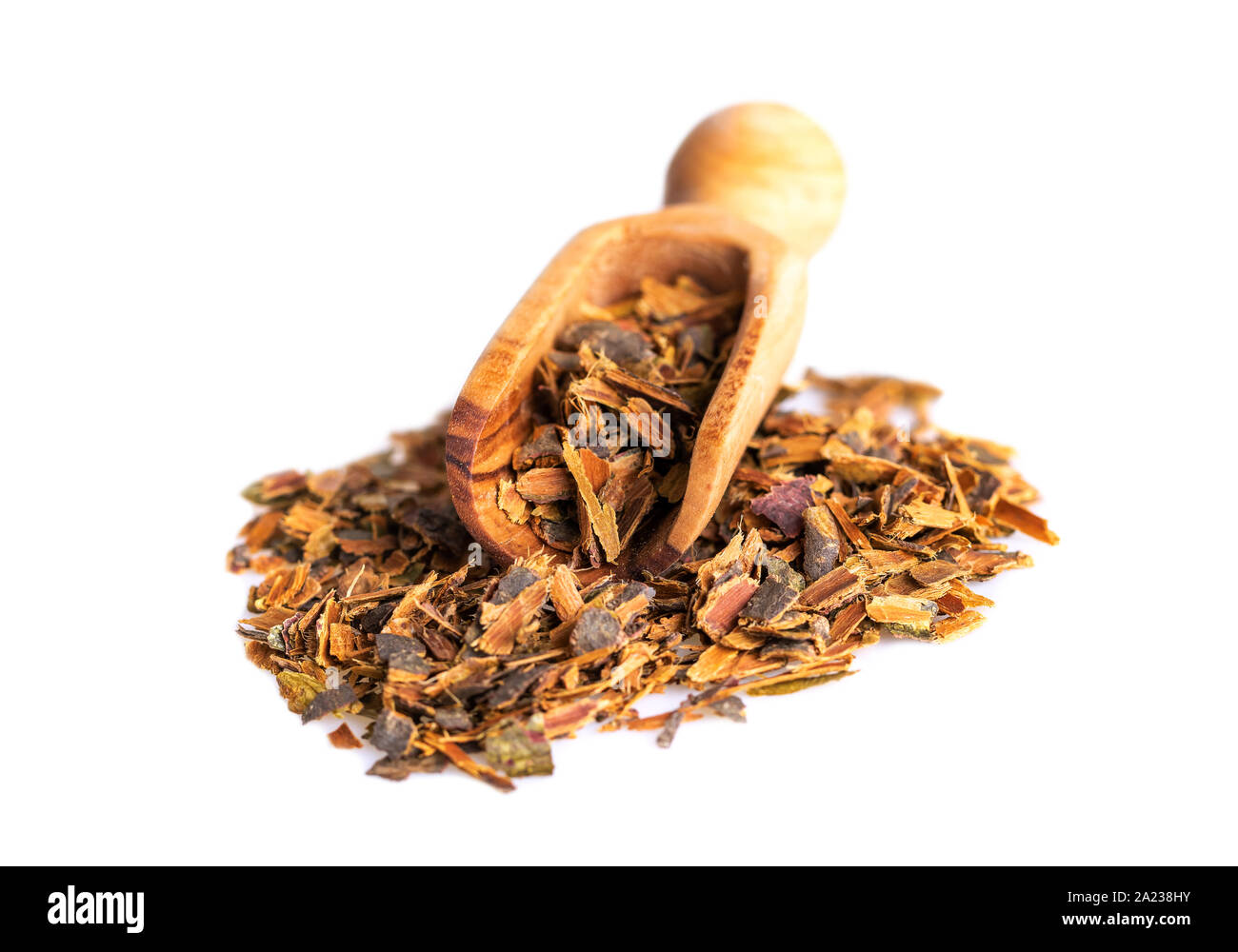 Alder buckthorn bark in wooden scoop. Buckthorn herbal tea is used as a laxative. Stock Photo