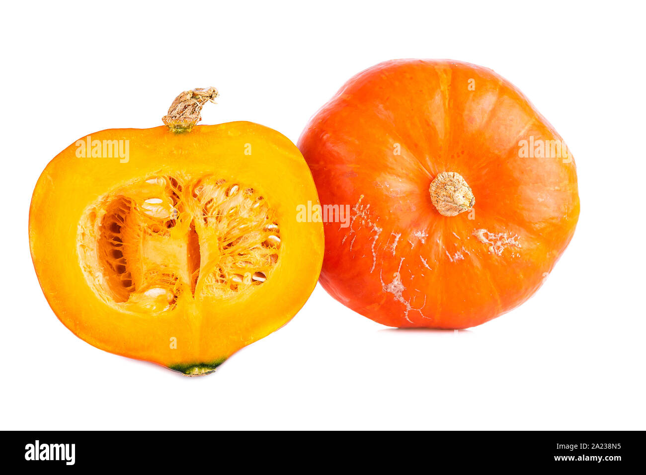 Hokkaido pumpkin two pumpkins whole and halved isolated on white Stock ...