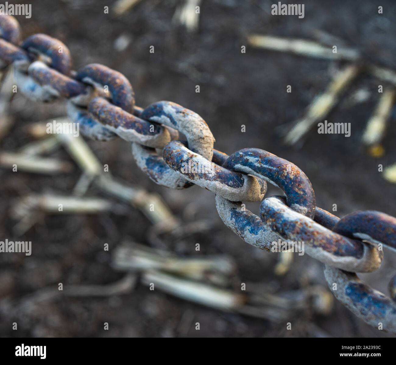 stained chain on dark background Stock Photo