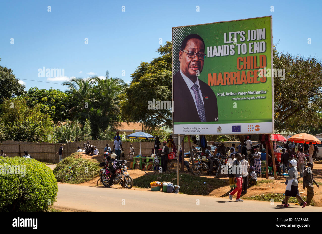Large roadside banner in Malawi of president Peter Mutharika promoting an end to child marriages Stock Photo