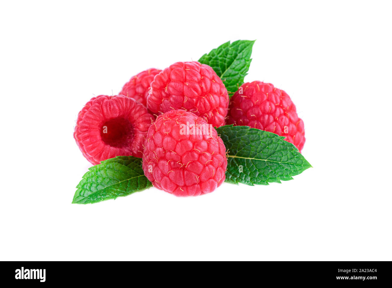 Heap of raspberries with fresh mint leaf isolated on white background Stock Photo