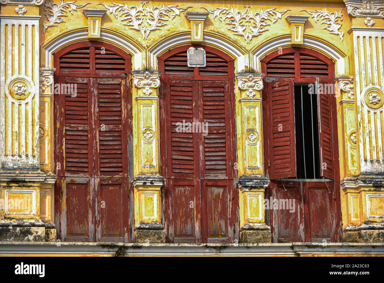 Rustic wooden doors of classic sino portuguese architecture in old town Phuket Thailand Stock Photo