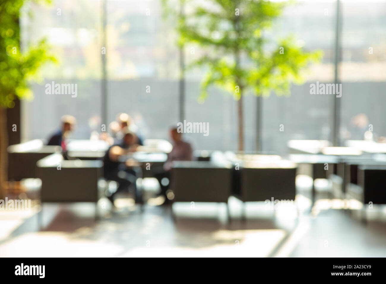 Blur image of open space for negotiations and relaxation with big window. Waiting place. Business concept. Stock Photo
