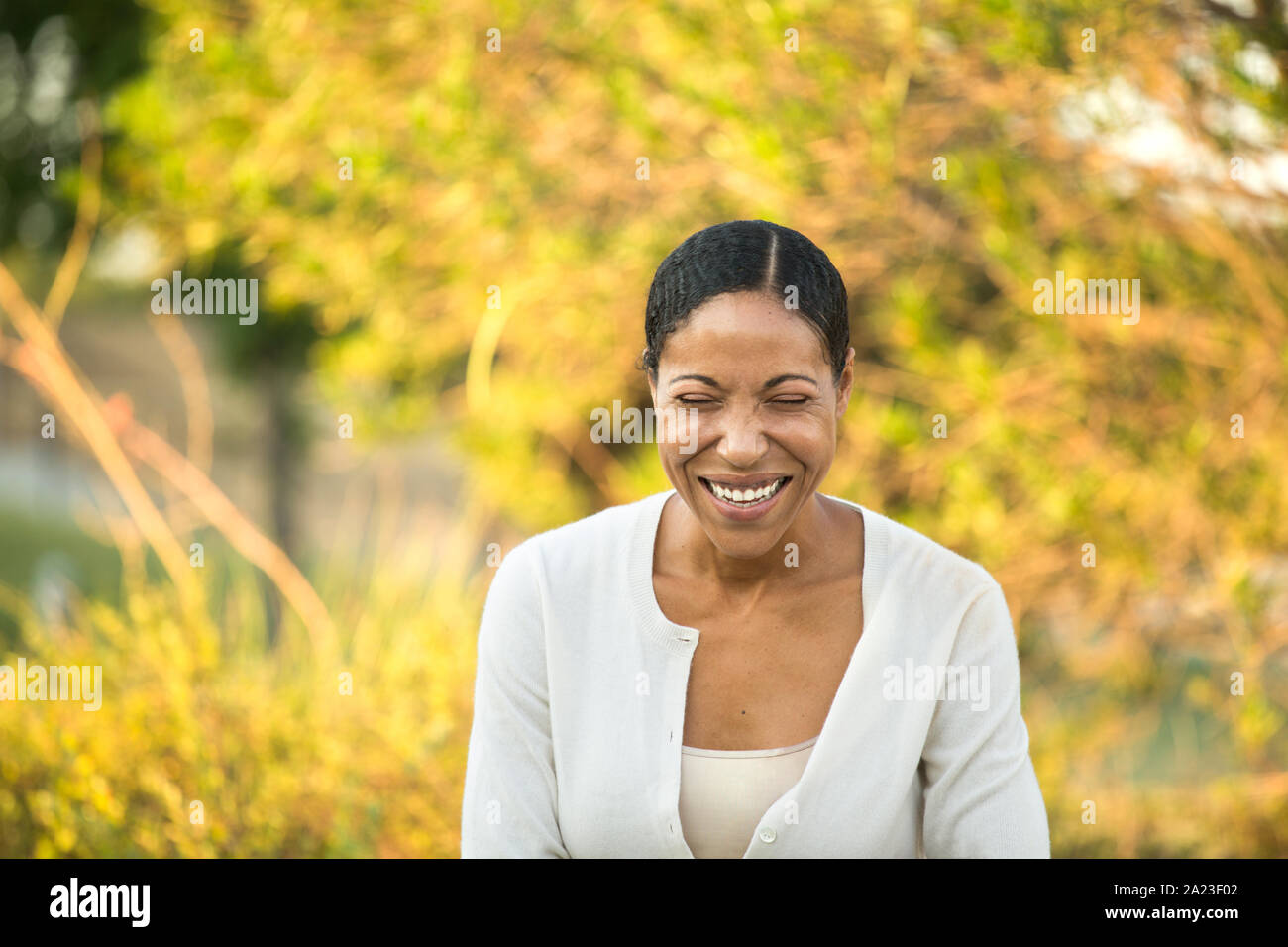 Mature confident African American woman smiling outside. Stock Photo