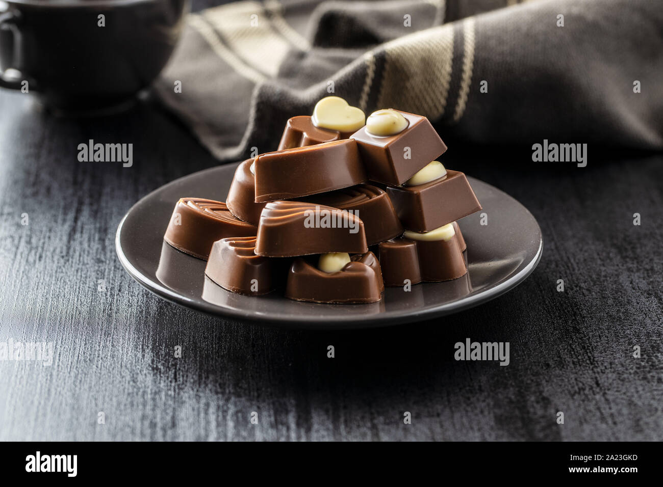 Various chocolate pralines on plate. Stock Photo