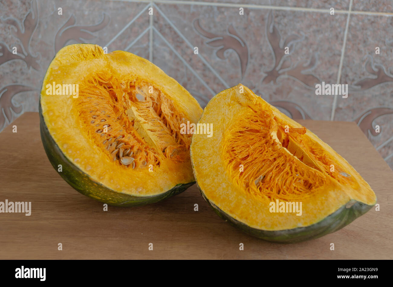 Cut Pumpkin On Board Table Stock Photo