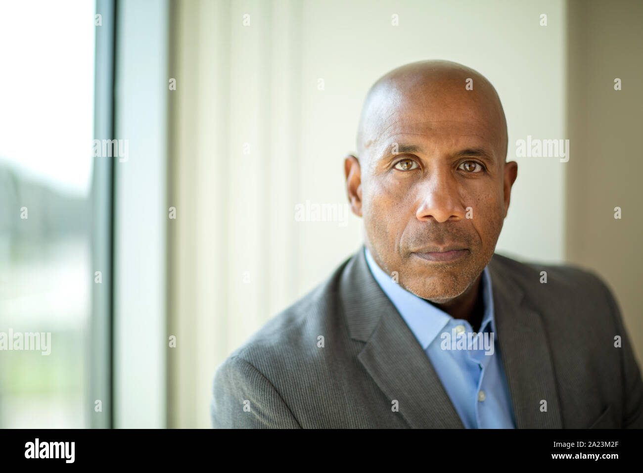 Happy mature African American man at work. Stock Photo