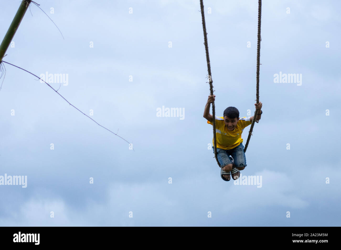 Kathmandu, Nepal. 30th Sep, 2019. A Nepalese boy rides a swing set up