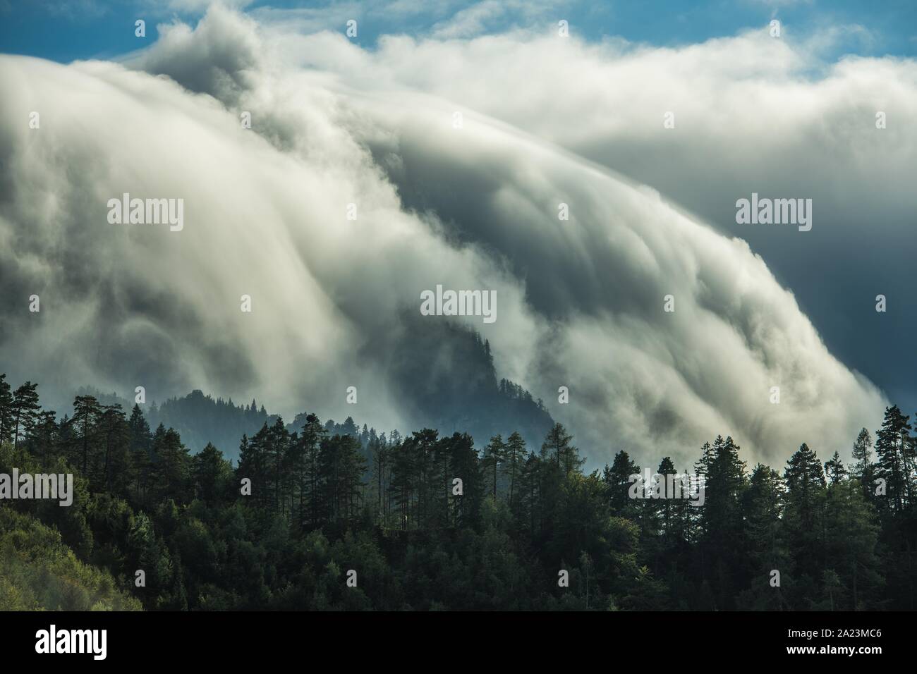 Scenic Waterfall-Like Orographic Clouds in Julian Alps, Slovenia. Meteorological Phenomena. Stock Photo