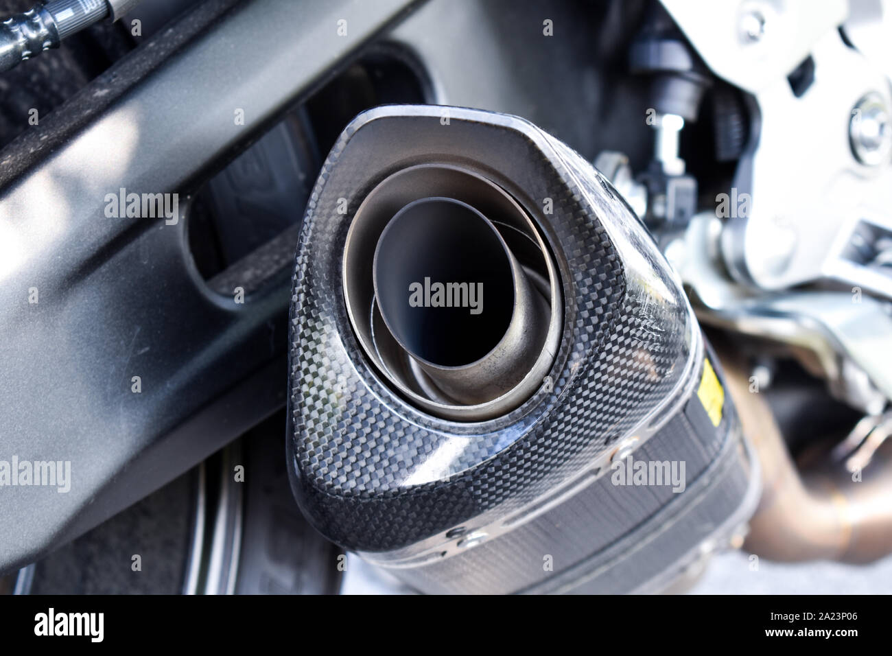 Close up view of a black carbon motorcycle exhaust pipe. Sport motorcycle, performance parts Stock Photo